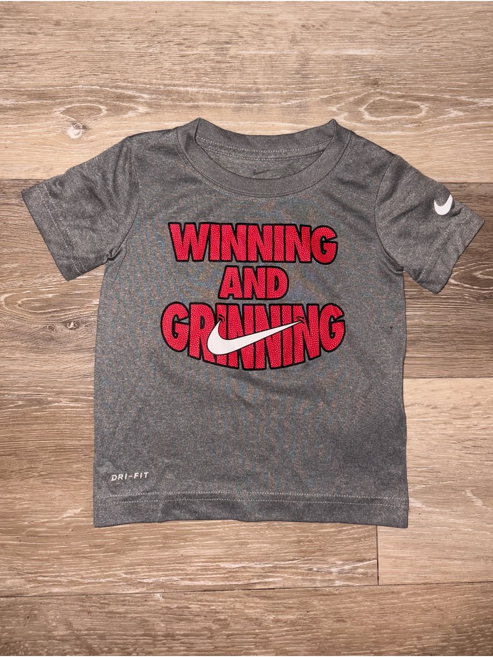 Nike Gray Dri-FIT Tee with Red "Winning and Grinning" Graphic
